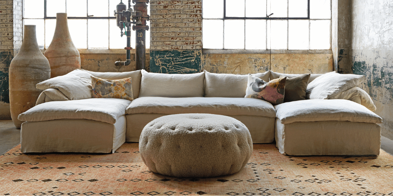 Cisco relaxed sectional and round tufted ottoman